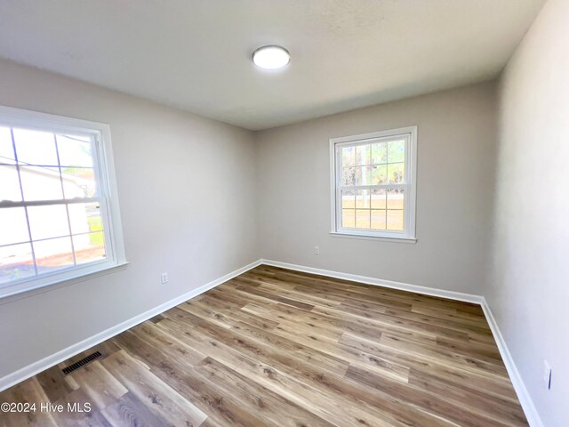 full bathroom with shower / tub combo, vanity, and toilet