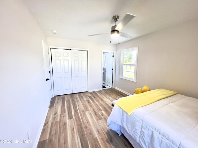 unfurnished bedroom with a closet and light hardwood / wood-style flooring