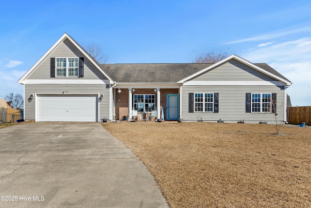 view of front of home featuring a garage and a front lawn