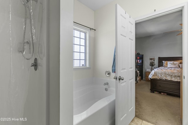 bathroom featuring a bathing tub and ceiling fan