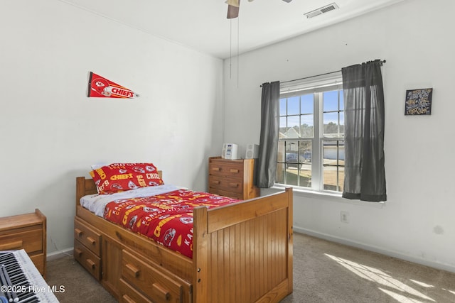 bedroom with ceiling fan and carpet flooring