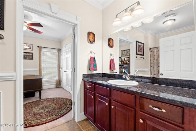 bathroom with ceiling fan, vanity, and ornamental molding