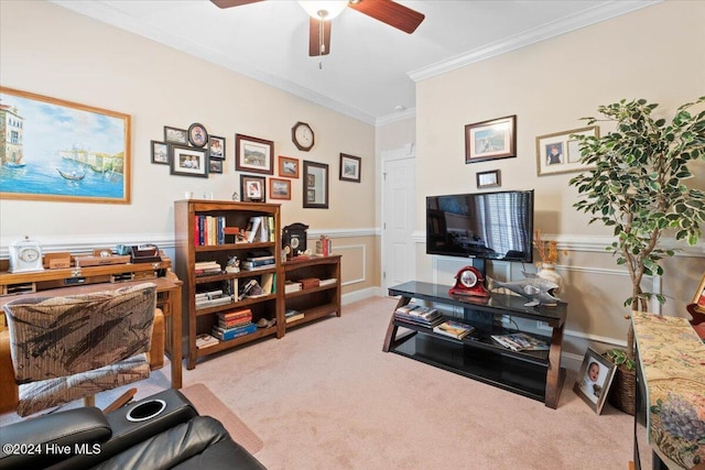 carpeted home office featuring ceiling fan and ornamental molding