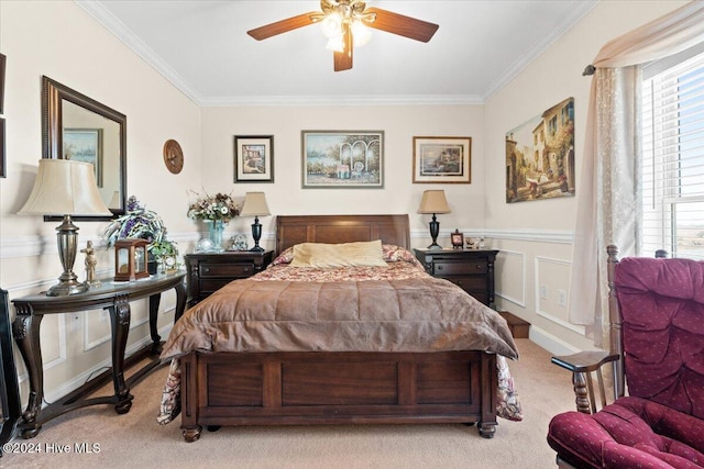 bedroom with ceiling fan, crown molding, and light colored carpet