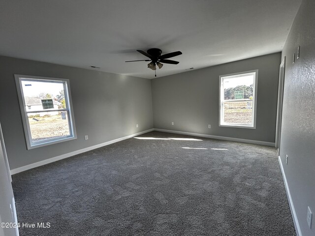 laundry room featuring electric dryer hookup and dark hardwood / wood-style flooring