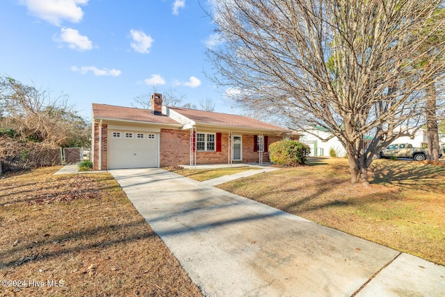 ranch-style home with a front yard and a garage