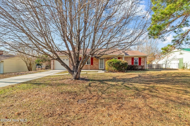 single story home with a garage and a front yard