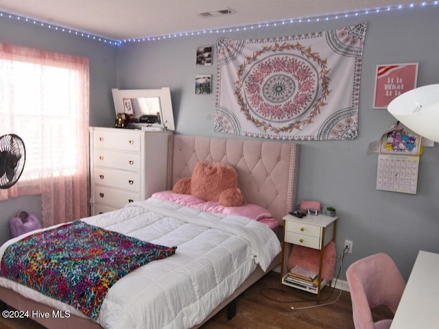 bedroom featuring hardwood / wood-style flooring