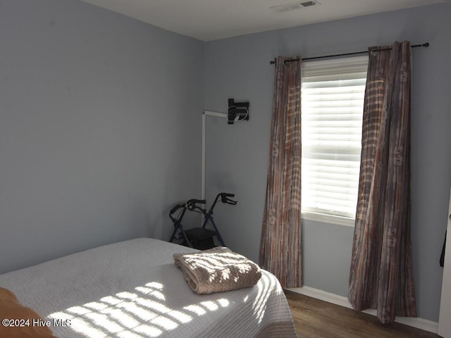 bedroom featuring wood-type flooring