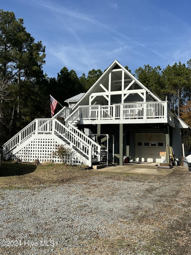 view of front of house featuring a garage and a deck