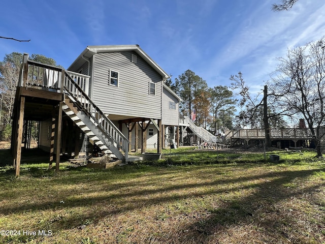 exterior space featuring a deck and a lawn