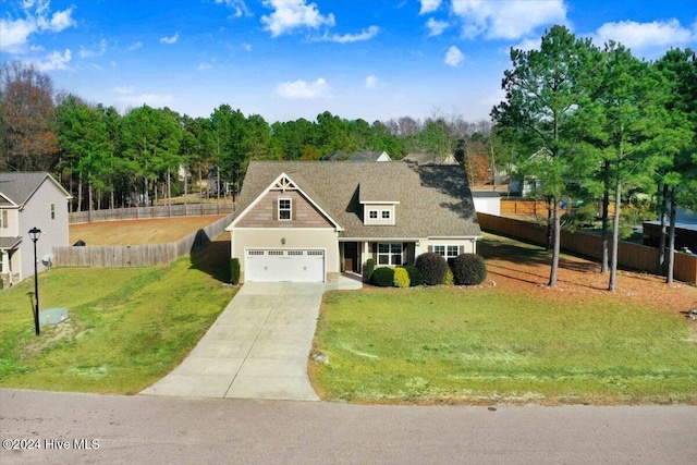 view of front of property featuring a front lawn and a garage