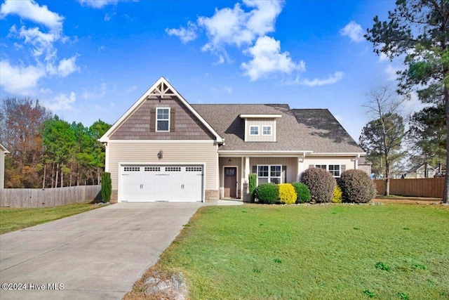 view of front facade with a front yard and a garage