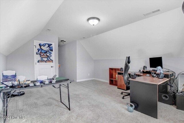 office featuring light carpet and vaulted ceiling