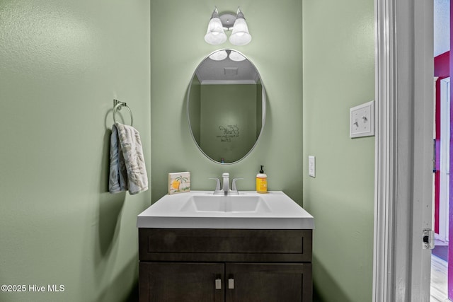 bathroom with vanity and crown molding