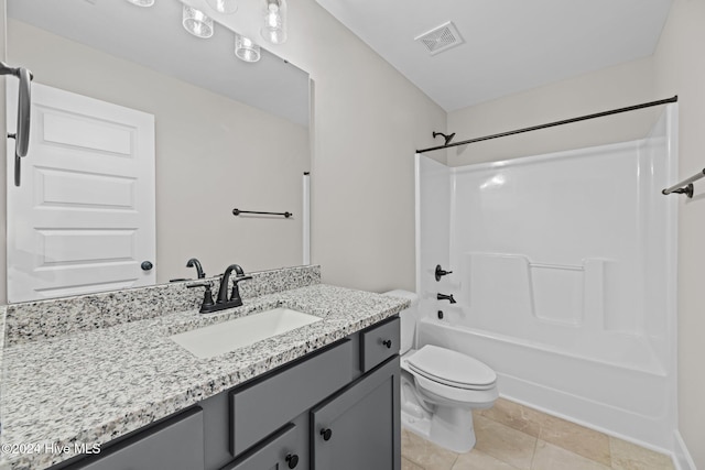 full bathroom featuring washtub / shower combination, vanity, toilet, and tile patterned flooring