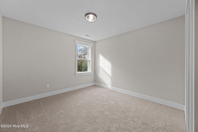 unfurnished room featuring carpet flooring