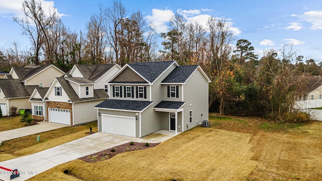 view of front of property featuring a front lawn, a garage, and central AC unit