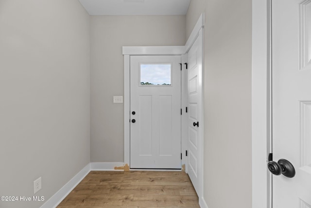 doorway with light wood-type flooring