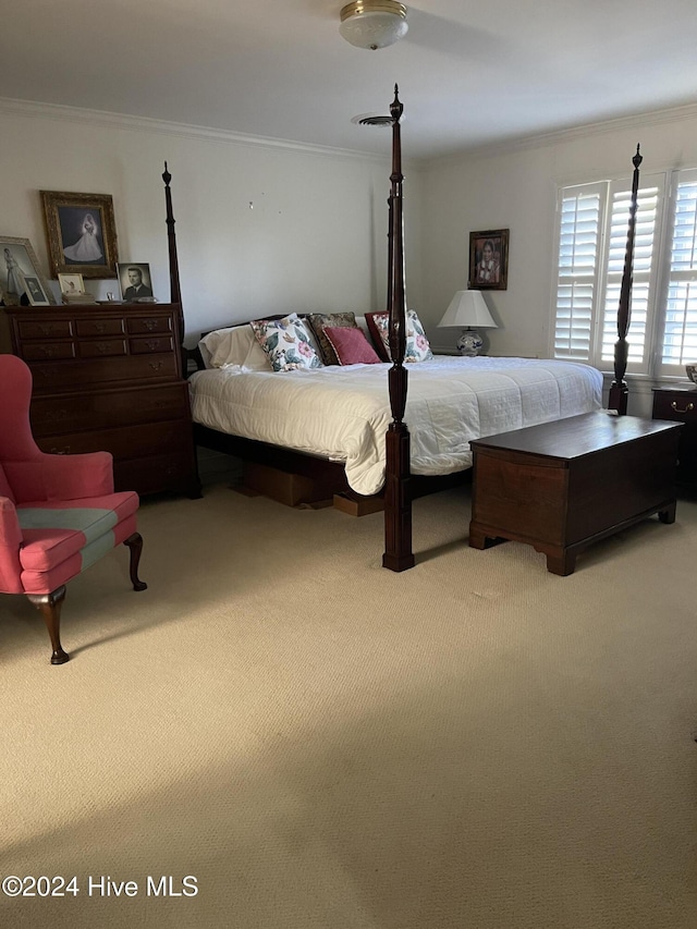 carpeted bedroom featuring ornamental molding