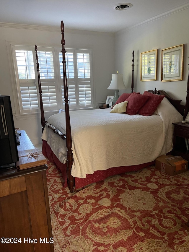 bedroom featuring ornamental molding