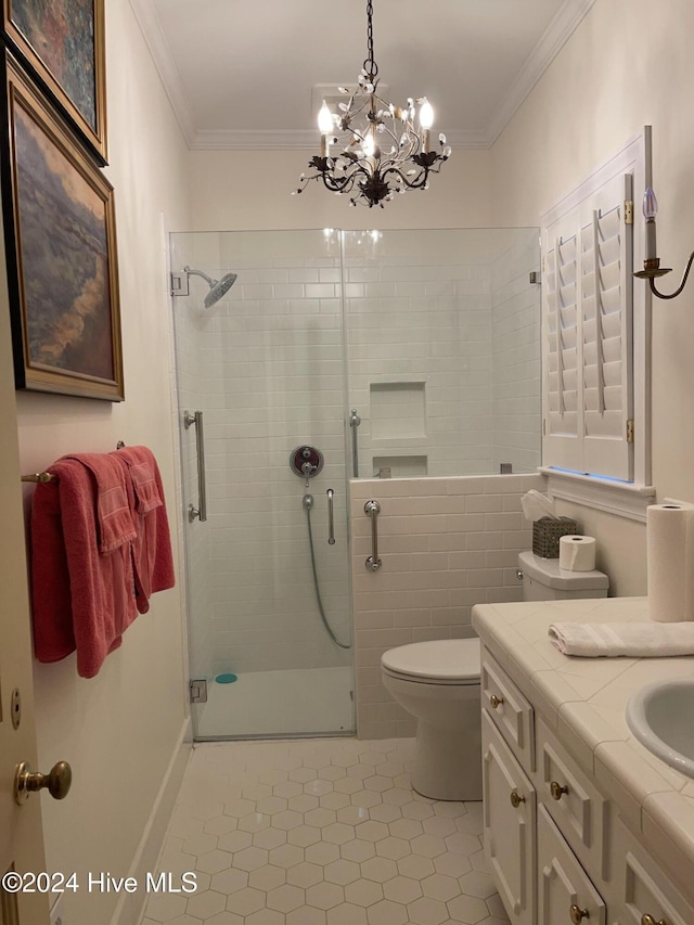 bathroom featuring vanity, tile patterned floors, crown molding, a notable chandelier, and an enclosed shower