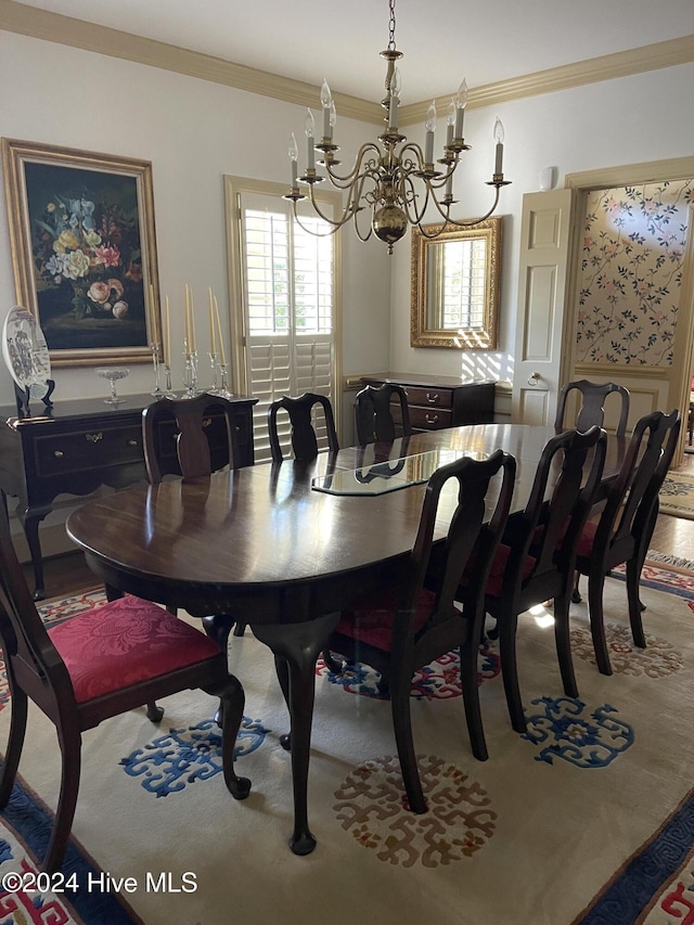 dining room featuring an inviting chandelier and ornamental molding