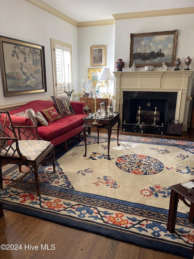 living room with hardwood / wood-style flooring and ornamental molding