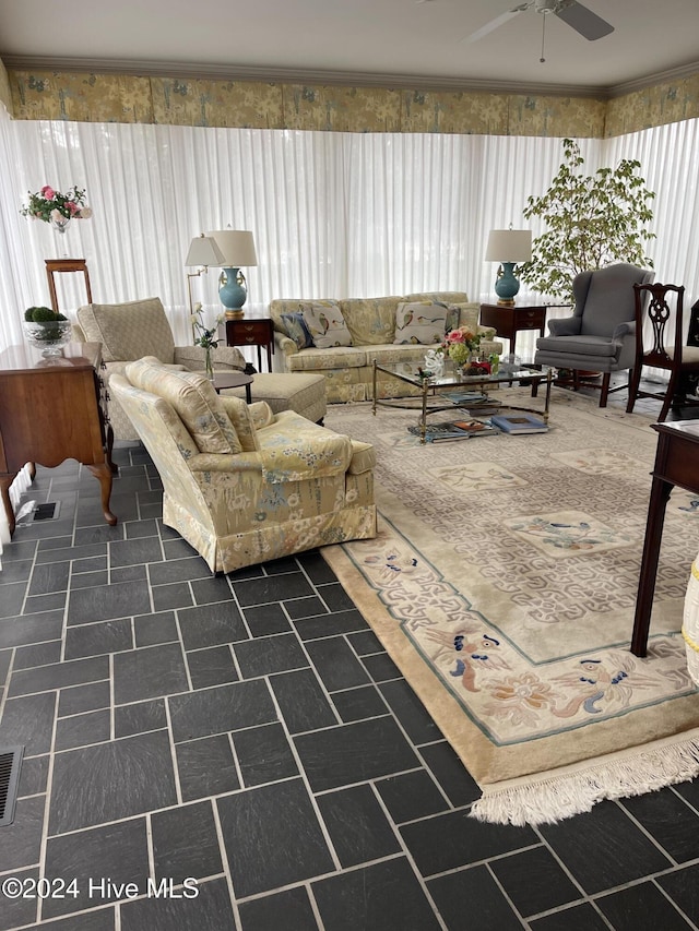 living room with ceiling fan and a healthy amount of sunlight