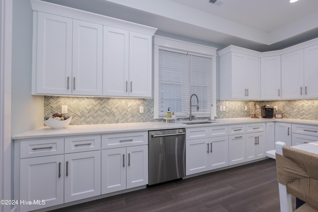 kitchen featuring sink, stainless steel dishwasher, white cabinets, and dark hardwood / wood-style flooring