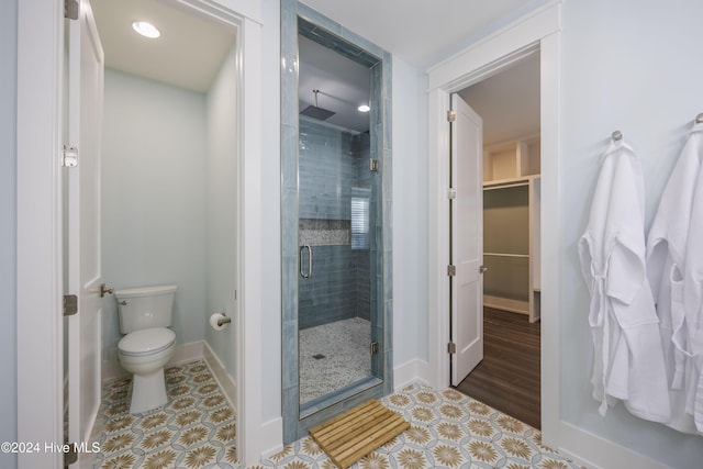 bathroom with toilet and walk in shower