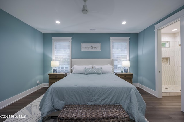 bedroom with dark hardwood / wood-style floors