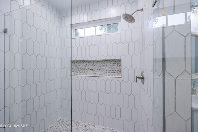 bathroom with tiled shower