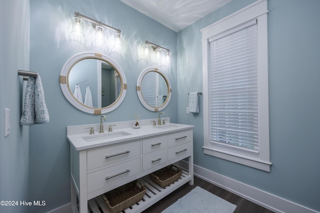 bathroom featuring vanity and hardwood / wood-style floors