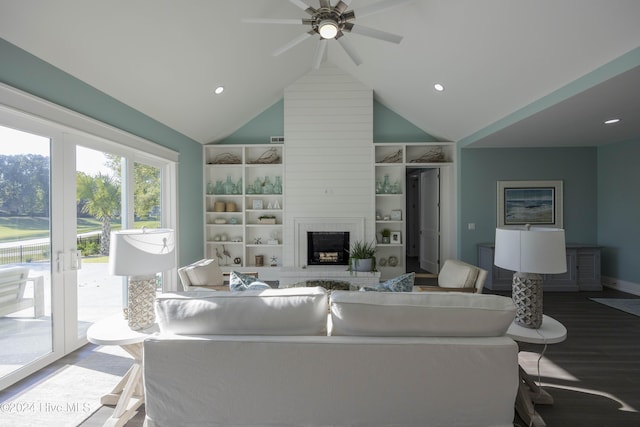 living room featuring french doors, hardwood / wood-style flooring, built in shelves, a large fireplace, and ceiling fan