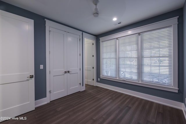 unfurnished bedroom featuring dark hardwood / wood-style floors