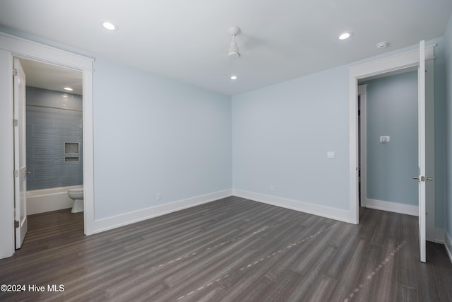 unfurnished bedroom featuring dark wood-type flooring