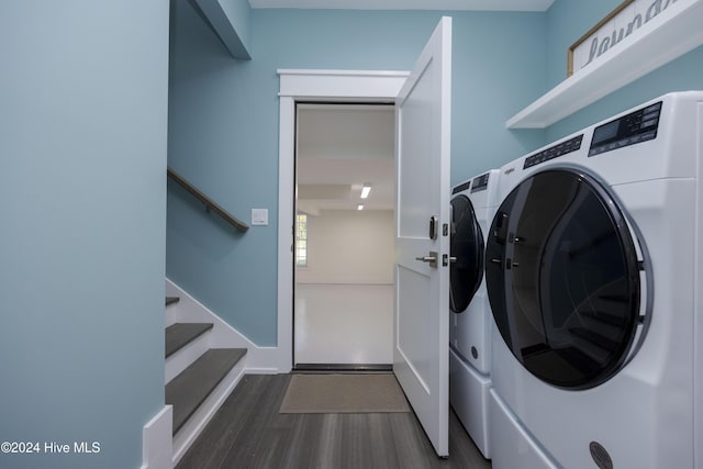 clothes washing area featuring independent washer and dryer and dark wood-type flooring