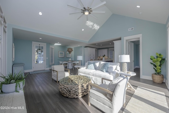 living room featuring high vaulted ceiling and wood-type flooring