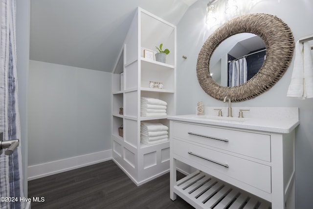 bathroom featuring vaulted ceiling, a shower with curtain, vanity, and wood-type flooring