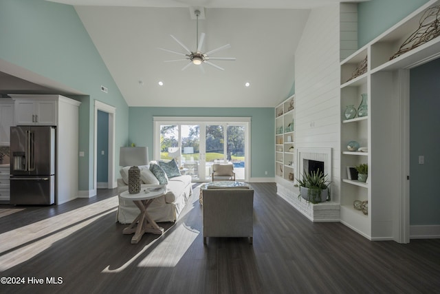 living room with a brick fireplace, built in shelves, dark hardwood / wood-style floors, ceiling fan, and high vaulted ceiling