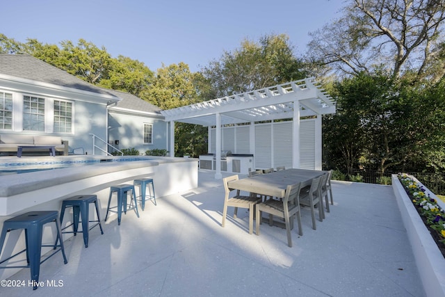 view of patio / terrace featuring area for grilling and a pergola