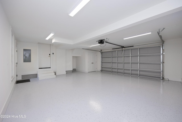 garage featuring electric panel and a garage door opener