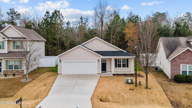 view of front facade with a front yard and a garage