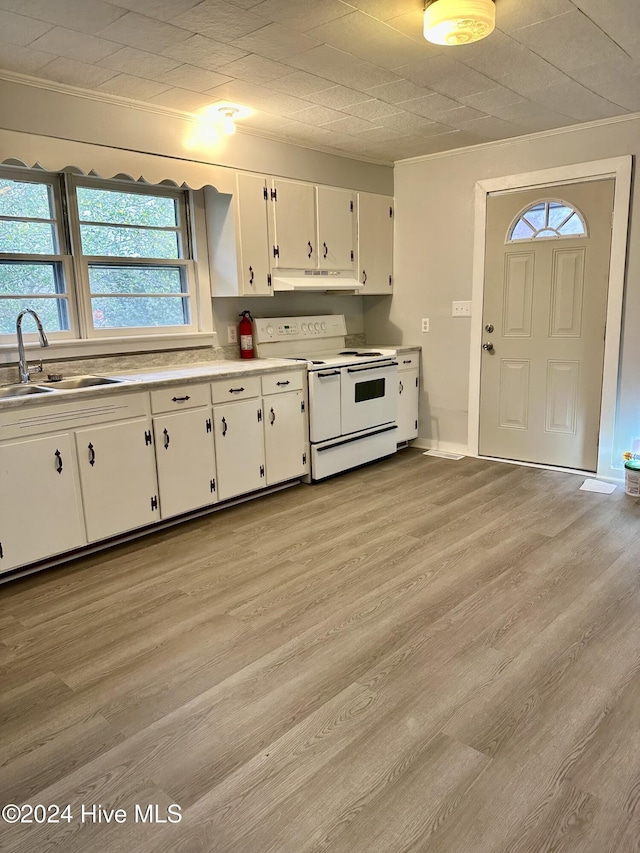 kitchen with white cabinetry, double oven range, sink, and light hardwood / wood-style flooring