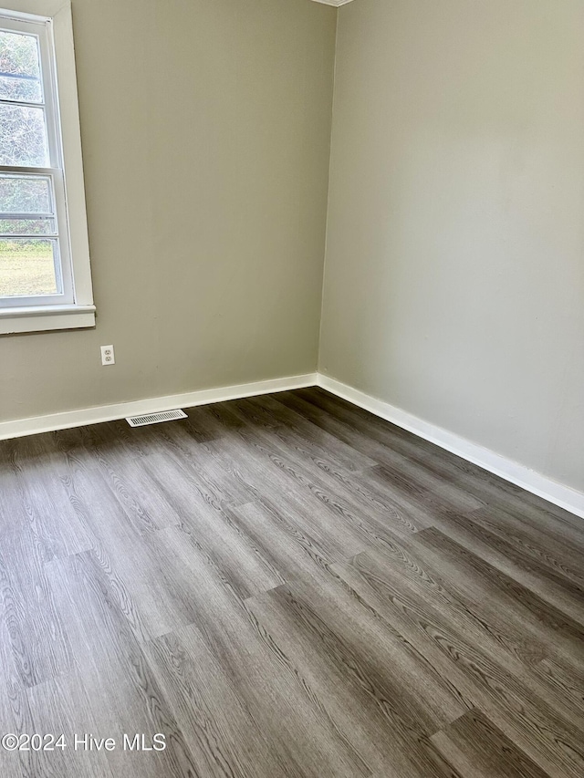 unfurnished room featuring wood-type flooring