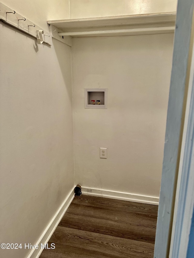 clothes washing area with dark wood-type flooring and hookup for a washing machine