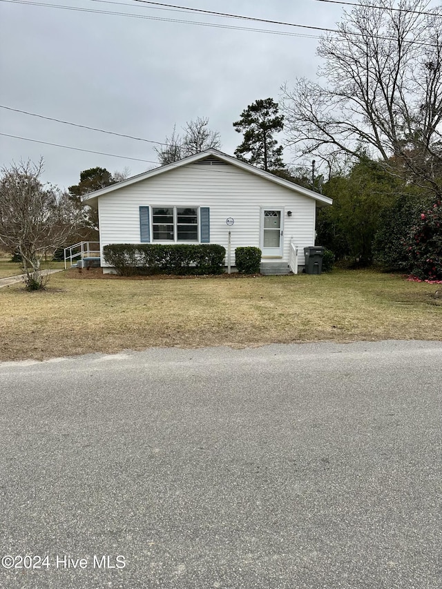 view of side of property with a yard