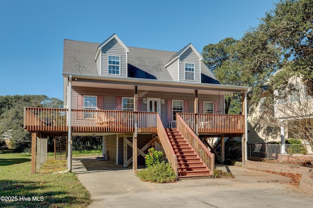 view of front facade with covered porch and a carport