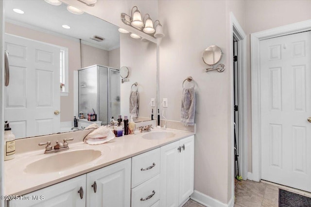 bathroom with tile patterned flooring, vanity, walk in shower, and crown molding